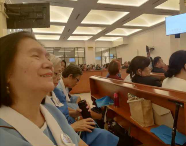 4 Gift giving of booklet for the Cause of Sr. Lucia\'s Great Vision of the Holy Trinity Booklet